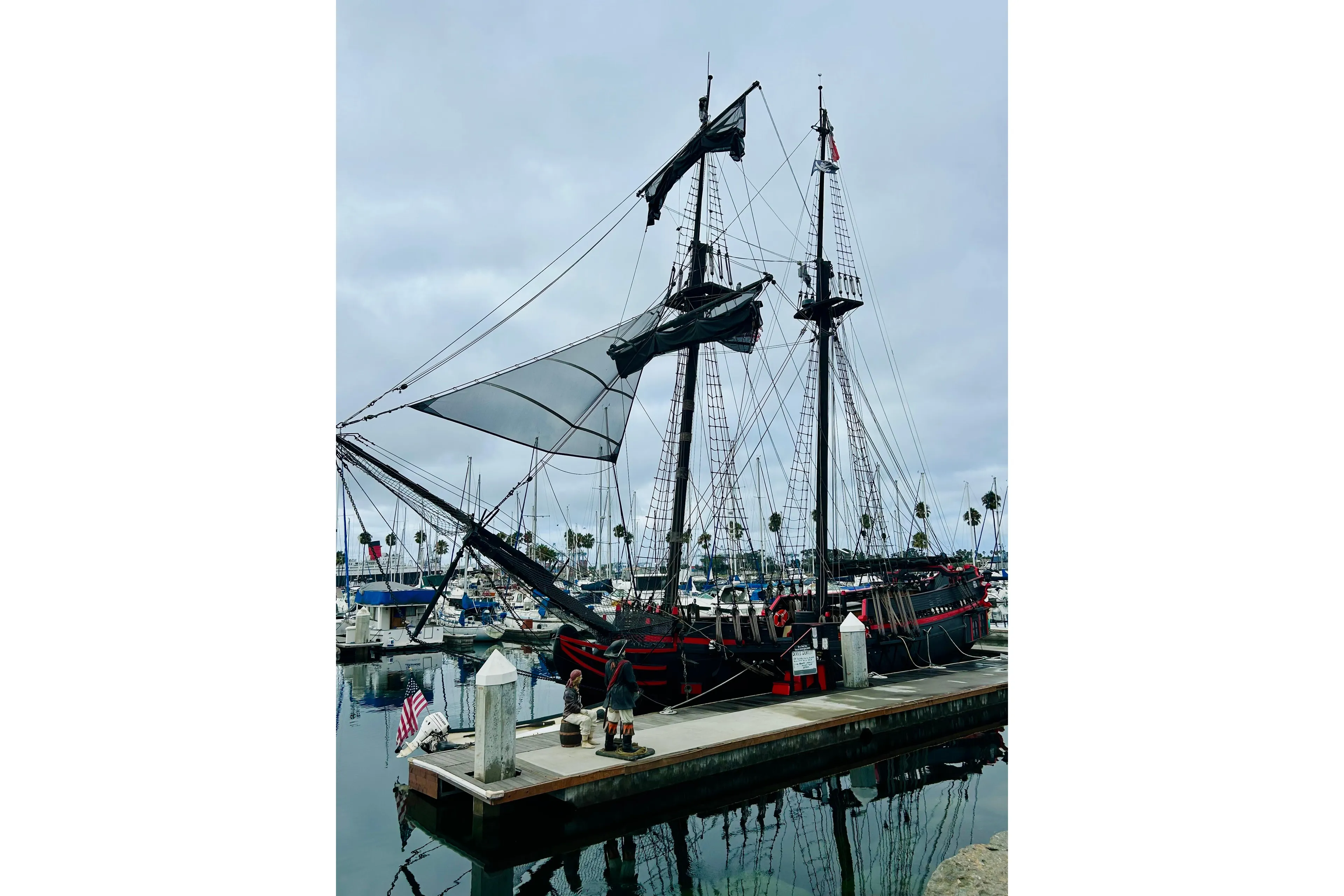 Vintage 1977 Custom Brigantine ship docked at a marina with overcast skies.