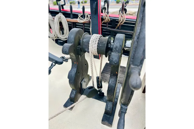 Devil's Gauntlet Yacht Photos Pics Close-up of a 1977 Custom Brigantine ship's winch with ropes and pulleys.