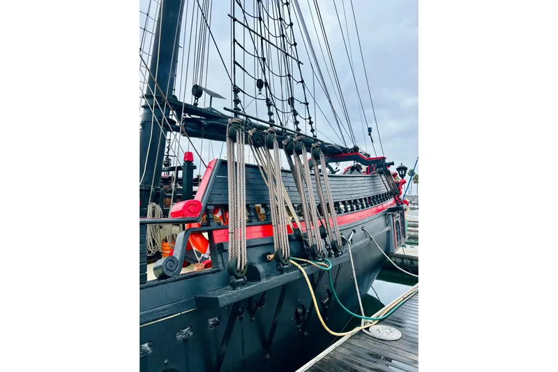 Devil's Gauntlet Yacht Photos Pics Vintage 1977 Custom Brigantine ship docked, showcasing intricate rigging and classic design.