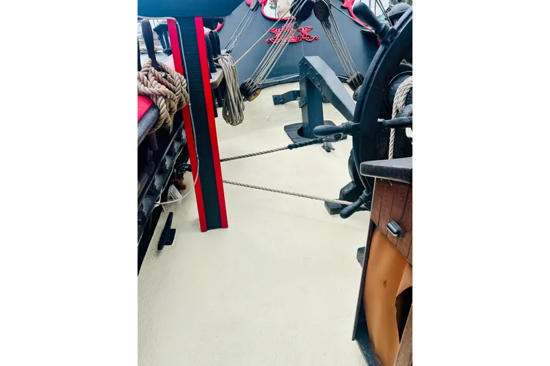 Devil's Gauntlet Yacht Photos Pics Deck view of a 1977 Custom Brigantine ship with ropes and nautical equipment.