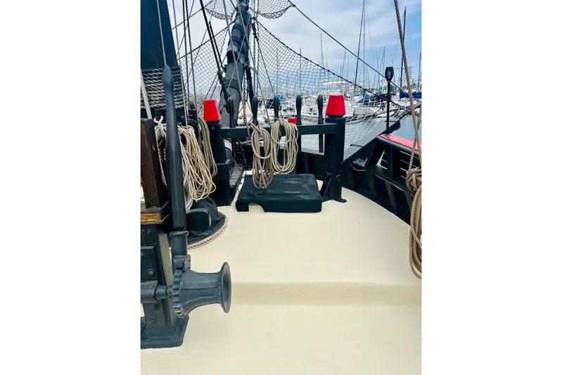 Devil's Gauntlet Yacht Photos Pics Deck of a 1977 Custom Brigantine ship with ropes and nautical equipment.