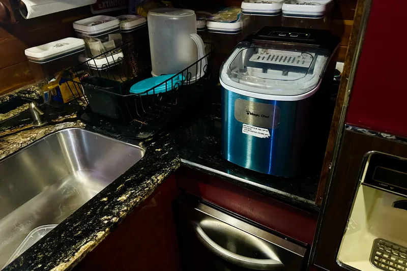 Devil's Gauntlet Yacht Photos Pics Kitchen counter with Magic Chef appliance, sink, and dish rack on a 1977 Custom Brigantine.
