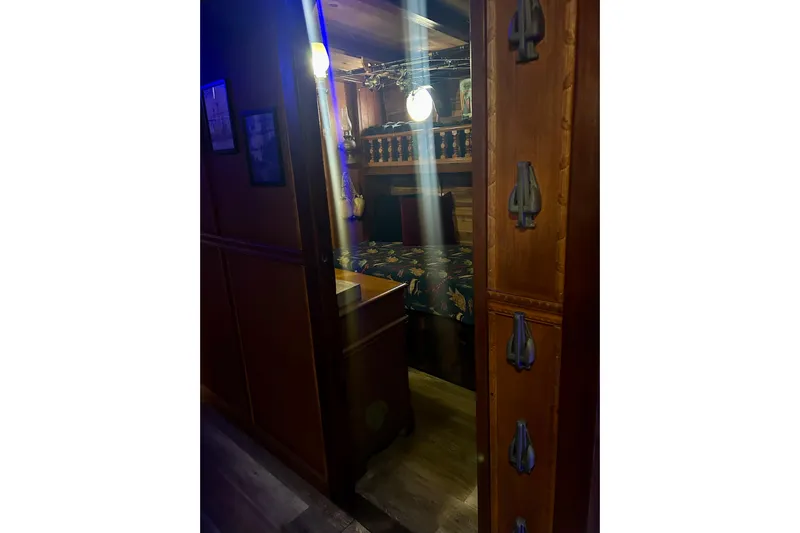 Devil's Gauntlet Yacht Photos Pics Cozy wooden cabin interior on a 1977 Custom Brigantine ship.