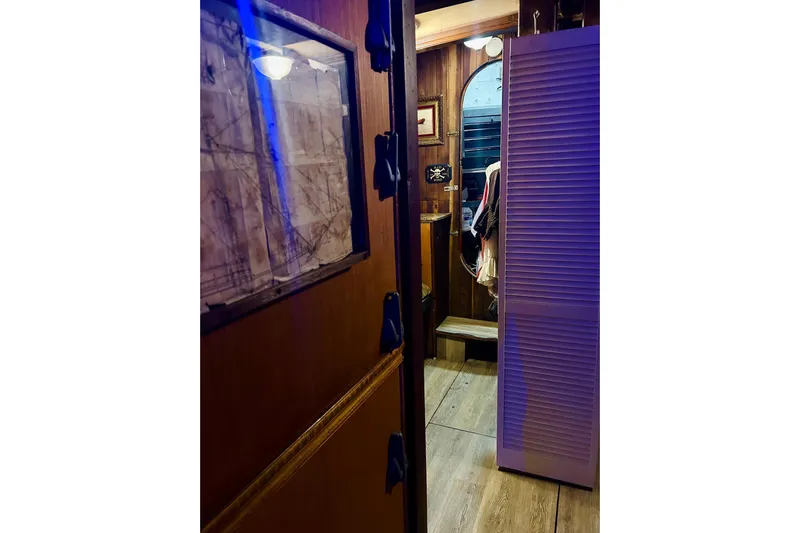 Devil's Gauntlet Yacht Photos Pics Interior of a 1977 Custom Brigantine with wooden decor and nautical elements.