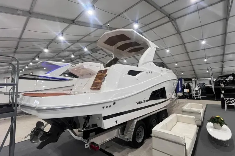 Ventura Yacht Photos Pics 2025 Ventura Daycruiser boat displayed indoors, showcasing sleek design and modern features.
