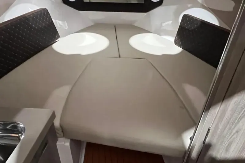 Ventura Yacht Photos Pics 2025 Ventura Daycruiser interior cabin with cushioned seating and modern design.