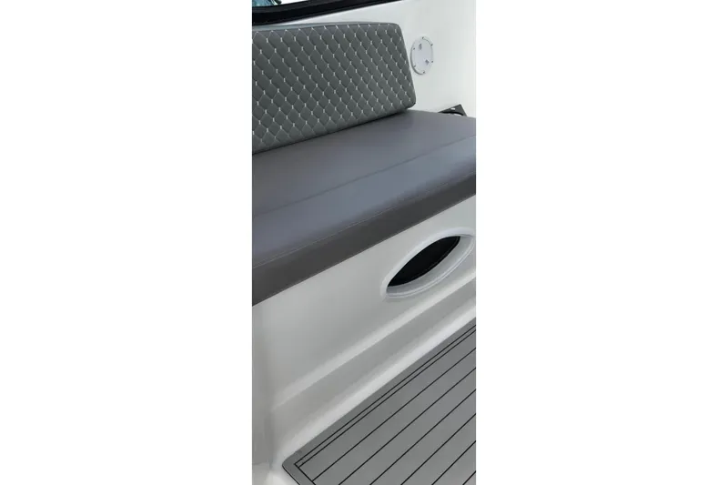 Ventura Yacht Photos Pics Ventura Daycruicer 2025 boat interior with cushioned seating and sleek design.