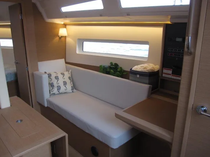  Yacht Photos Pics Interior of 2024 Jeanneau 380 sailboat with modern seating and natural light.