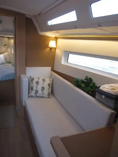  Yacht Photos Pics Interior of 2024 Jeanneau 380 sailboat with modern seating and decor.