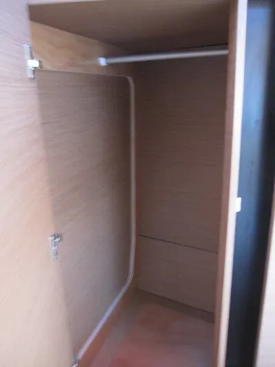  Yacht Photos Pics 2024 Jeanneau 380 yacht interior closet with wooden finish