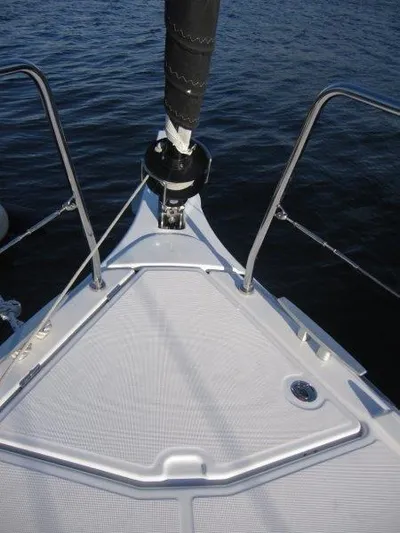  Yacht Photos Pics Bow of 2024 Jeanneau 380 sailboat on calm water.