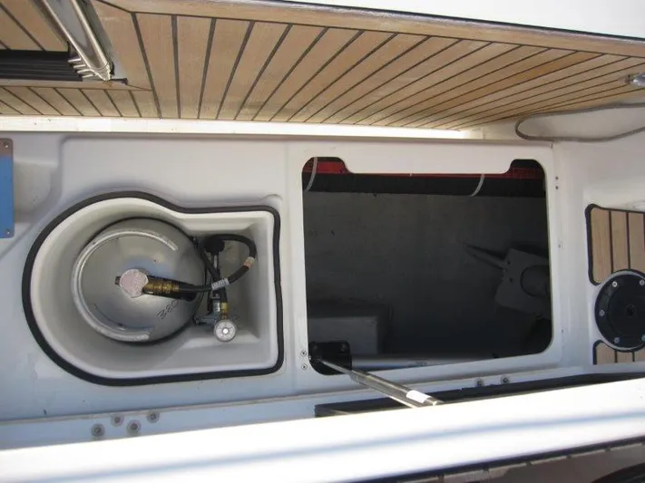  Yacht Photos Pics Jeanneau 380 2024 model boat storage compartment with gas cylinder.