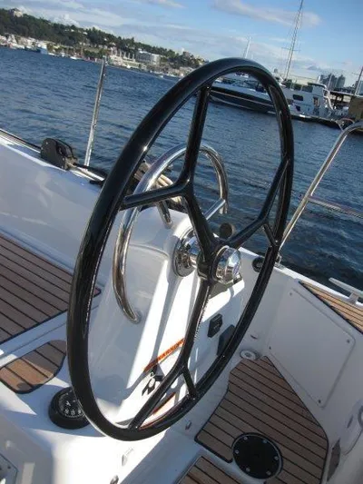  Yacht Photos Pics Steering wheel of a 2024 Jeanneau 380 sailboat on a sunny day.
