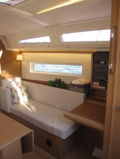  Yacht Photos Pics Interior of 2024 Jeanneau 380 sailboat with modern seating and natural light.