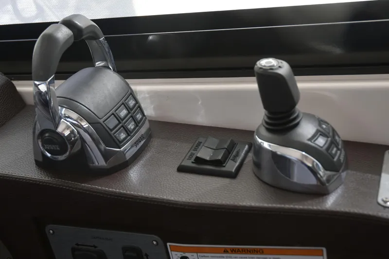  Yacht Photos Pics Control panel of 2013 Regal 42 Sport Coupe with joystick and throttle levers.