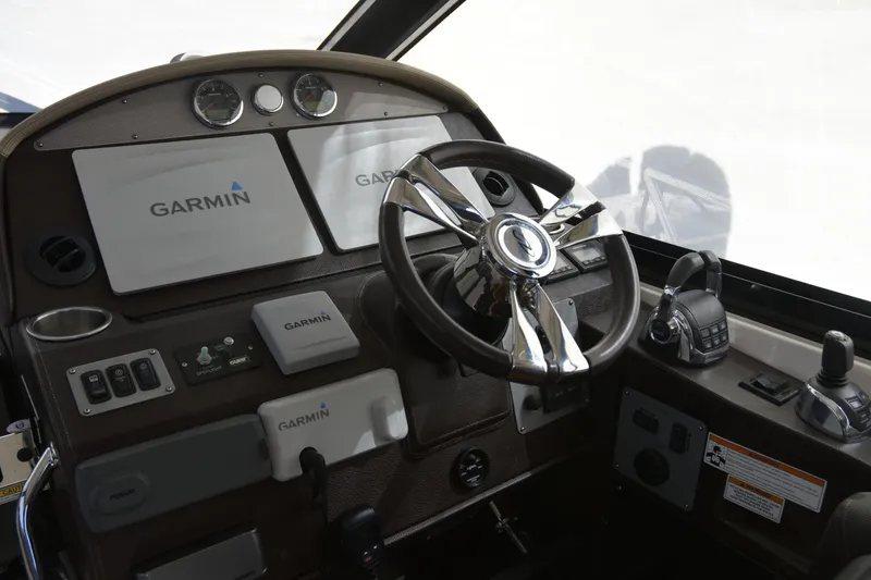  Yacht Photos Pics 2013 Regal 42 Sport Coupe helm with Garmin navigation and modern controls.