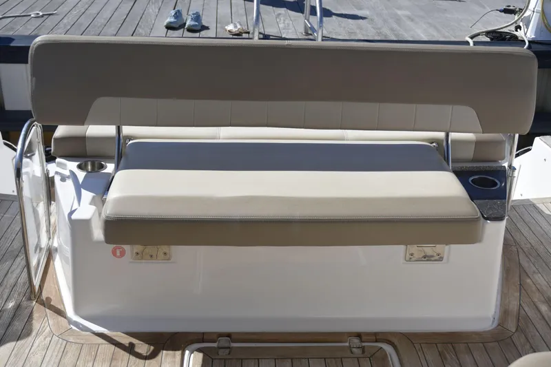  Yacht Photos Pics 2013 Regal 42 Sport Coupe boat seating area with cup holders on deck.