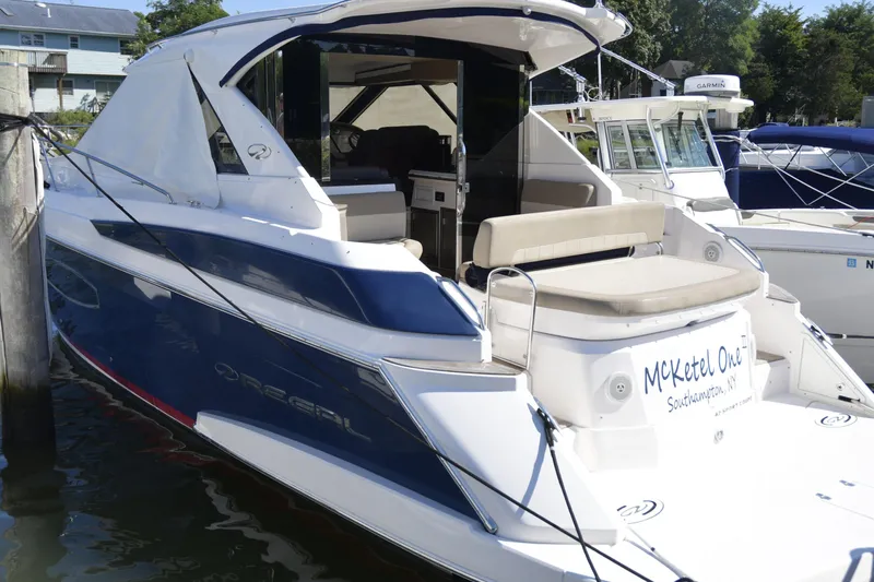  Yacht Photos Pics 2013 Regal 42 Sport Coupe yacht docked, featuring sleek design and spacious seating.