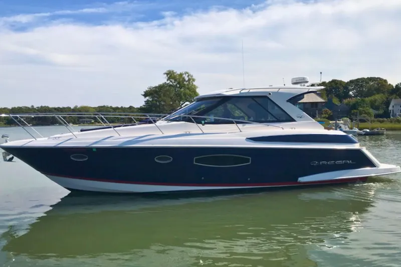  Yacht Photos Pics 2013 Regal 42 Sport Coupe yacht on calm water, side view.