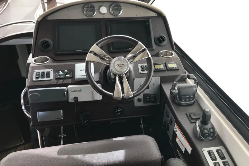  Yacht Photos Pics Cockpit of 2013 Regal 42 Sport Coupe with Garmin navigation and modern controls.