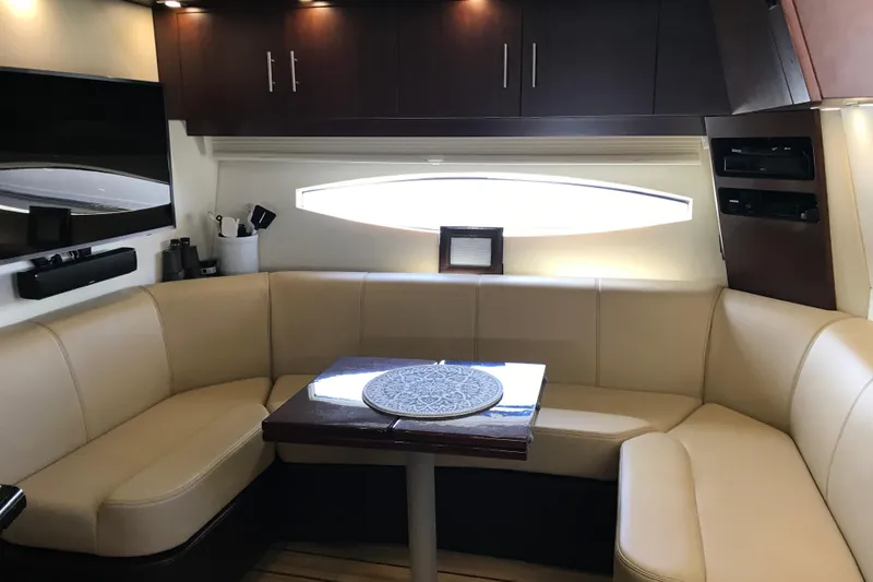  Yacht Photos Pics Luxurious interior of 2013 Regal 42 Sport Coupe with beige seating and modern amenities.