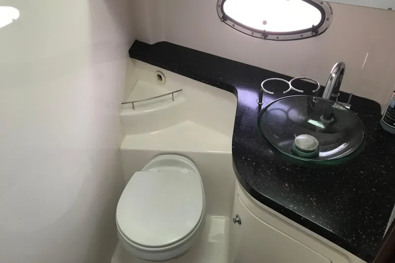  Yacht Photos Pics Bathroom interior of 2013 Regal 42 Sport Coupe yacht with modern fixtures.