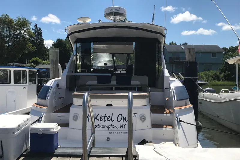  Yacht Photos Pics 2013 Regal 42 Sport Coupe docked, rear view, sunny day, Southampton, NY.