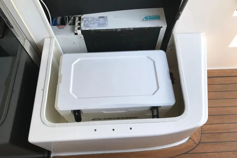  Yacht Photos Pics Storage compartment on 2013 Regal 42 Sport Coupe boat with cooling unit.
