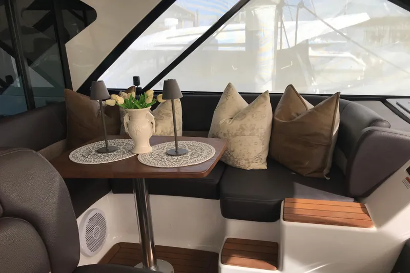  Yacht Photos Pics Luxurious interior of 2013 Regal 42 Sport Coupe with elegant seating and decor.