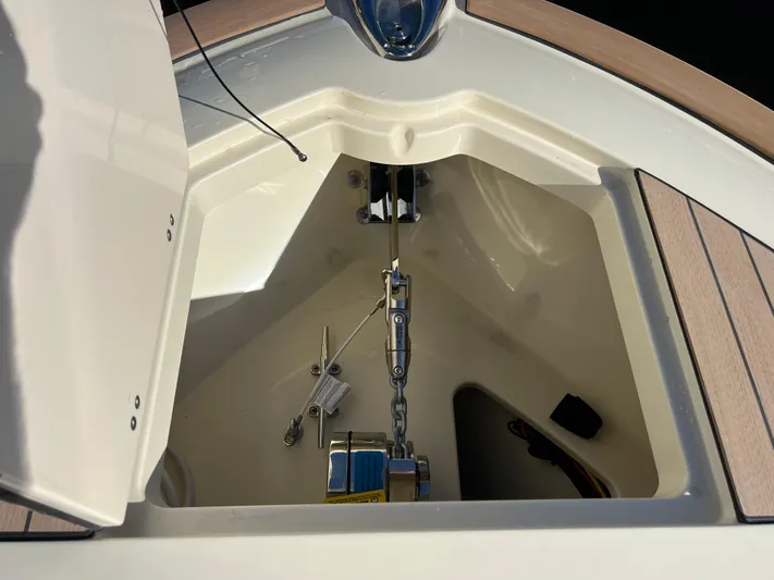  Yacht Photos Pics Anchor compartment of 2025 Chris-Craft Calypso 28 boat, featuring chain and hardware.