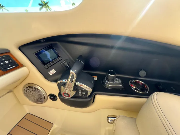  Yacht Photos Pics 2025 Chris-Craft Calypso 28 helm controls with modern dashboard and luxurious interior.