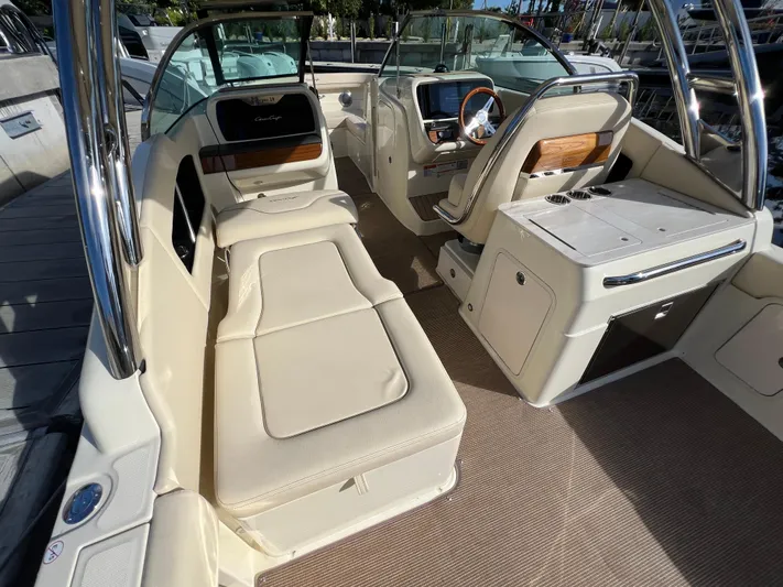  Yacht Photos Pics 2025 Chris-Craft Calypso 28 boat interior with luxurious seating and modern dashboard.