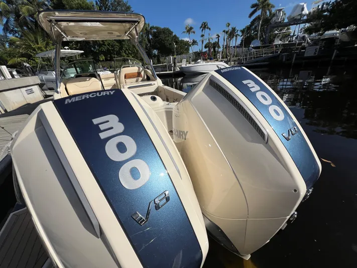 Yacht Photos Pics 2025 Chris-Craft Calypso 28 with twin Mercury 300 V8 engines docked by the water.