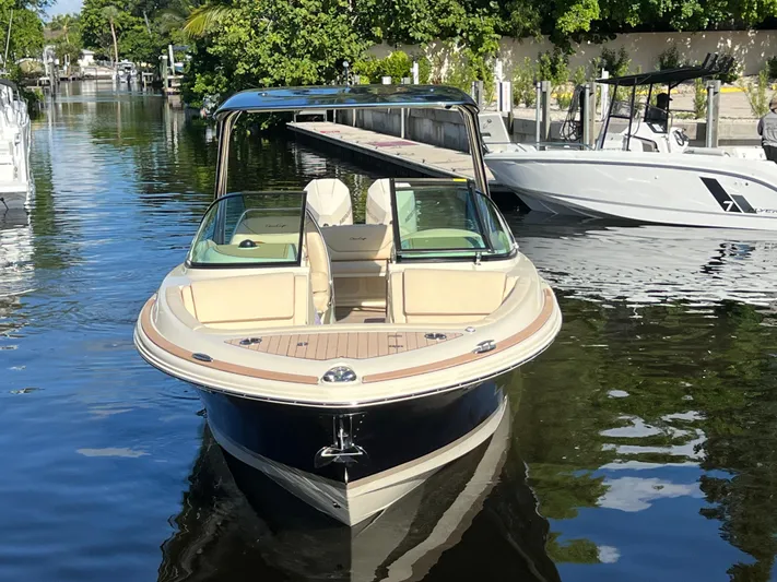  Yacht Photos Pics 2025 Chris-Craft Calypso 28 boat docked on a calm waterway.