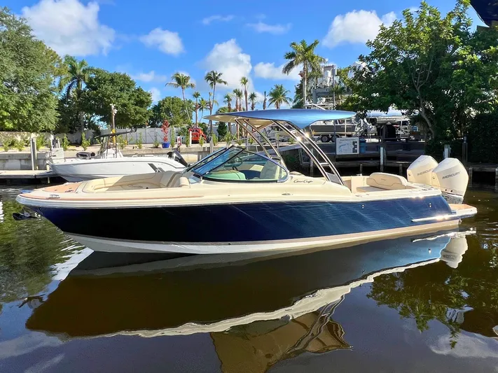  Yacht Photos Pics 2025 Chris-Craft Calypso 28 boat docked in a sunny marina setting.