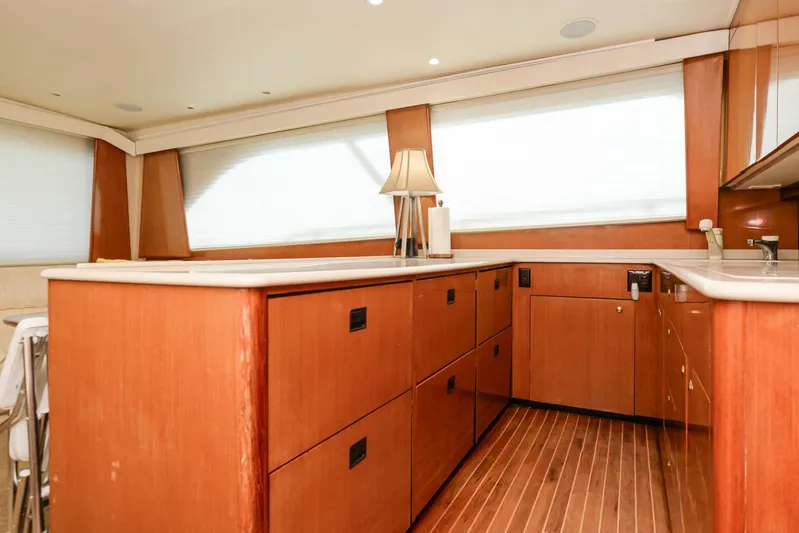 Sue-sea Yacht Photos Pics Interior of 1999 Viking 55 Convertible yacht with wooden cabinetry and modern design.