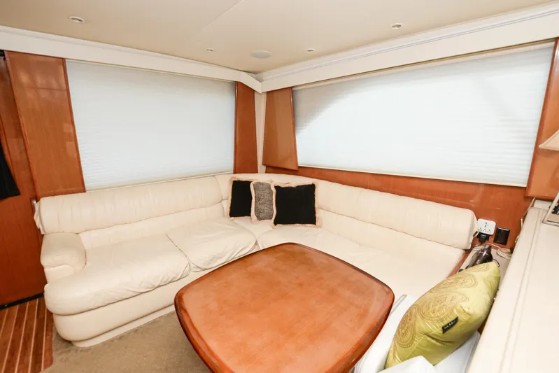 Sue-sea Yacht Photos Pics Luxurious interior of 1999 Viking 55 Convertible yacht with cream leather seating.
