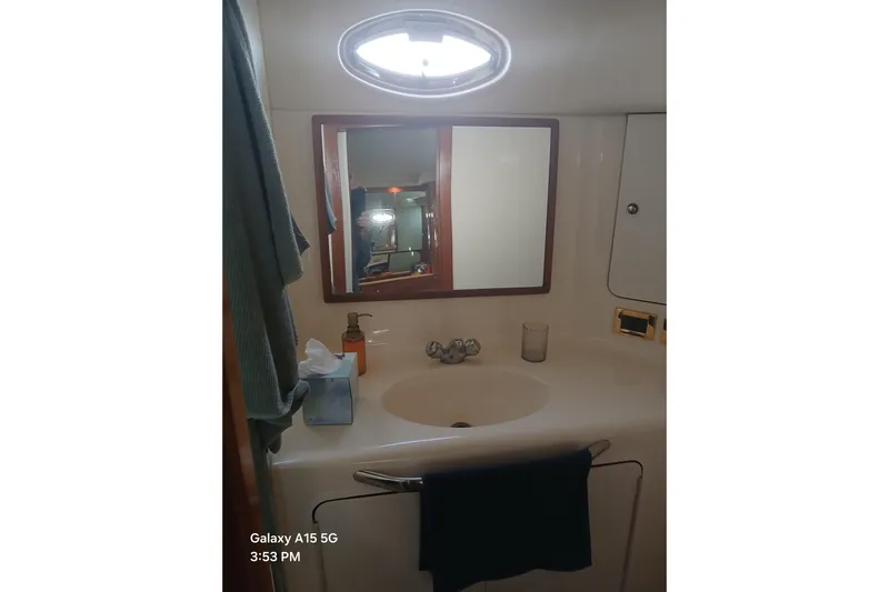  Yacht Photos Pics Bathroom vanity in 2000 Sea Ray 420 Aft Cabin yacht, featuring sink and mirror.