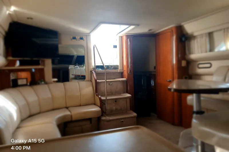  Yacht Photos Pics Interior of 2000 Sea Ray 420 Aft Cabin yacht with plush seating and stairs.