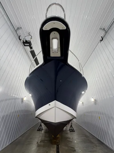  Yacht Photos Pics Pursuit OS 385 Offshore 2016 in storage facility, front view.