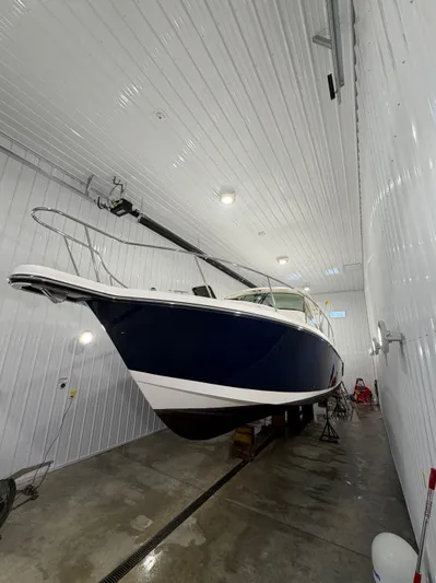  Yacht Photos Pics 2016 Pursuit OS 385 Offshore boat in storage facility.