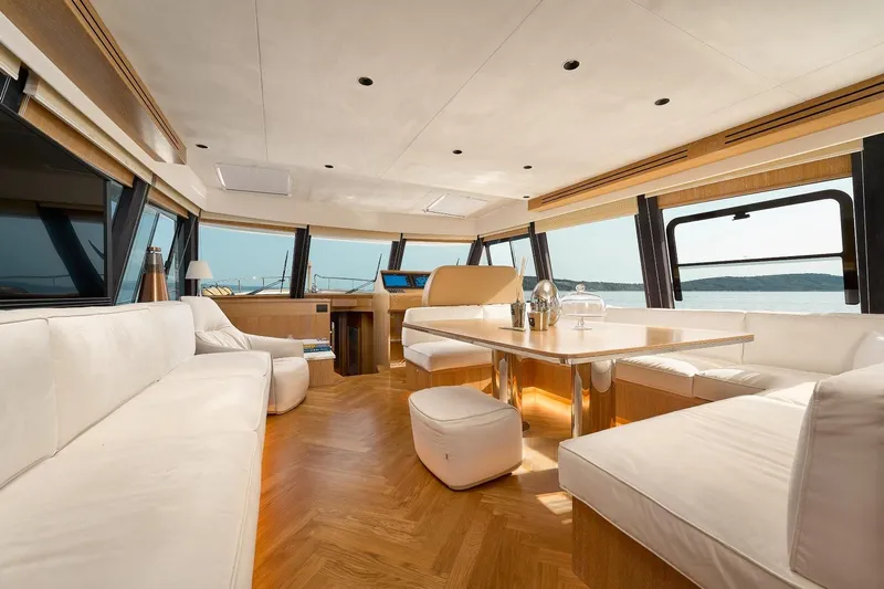 Sasga Yachts 68 Flybridge Yacht Photos Pics Luxurious interior of 2026 Sasga Yachts Menorquin 68 FB with elegant seating and panoramic windows.