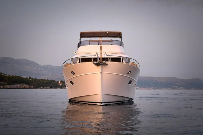 Sasga Yachts 68 Flybridge Yacht Photos Pics 2026 Sasga Yachts Menorquin 68 FB on calm waters, front view.