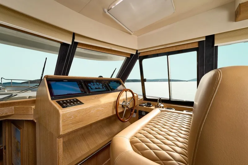 Sasga Yachts 68 Flybridge Yacht Photos Pics Luxurious helm of 2026 Sasga Yachts Menorquin 68 FB with leather seating and modern controls.