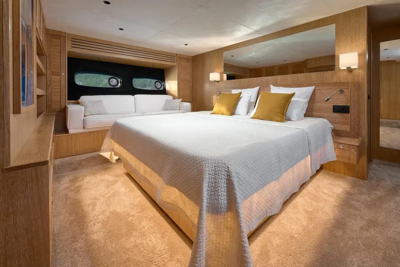 Sasga Yachts 68 Flybridge Yacht Photos Pics Luxurious bedroom interior of 2026 Sasga Yachts Menorquin 68 FB with elegant wood finishes.