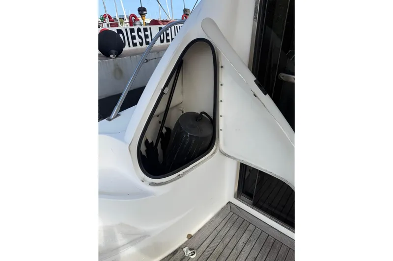 Gambit Yacht Photos Pics Open fender storage compartment on 2001 Sea Ray 560 Sedan Bridge yacht deck.