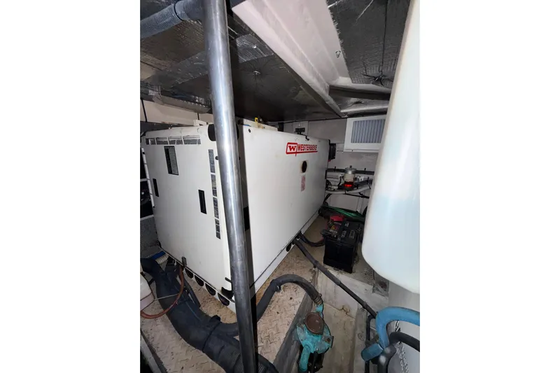 Gambit Yacht Photos Pics Engine room of 2001 Sea Ray 560 Sedan Bridge with Westerbeke generator.