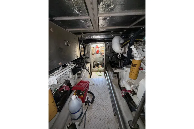 Gambit Yacht Photos Pics Engine room of 2001 Sea Ray 560 Sedan Bridge with visible machinery and equipment.