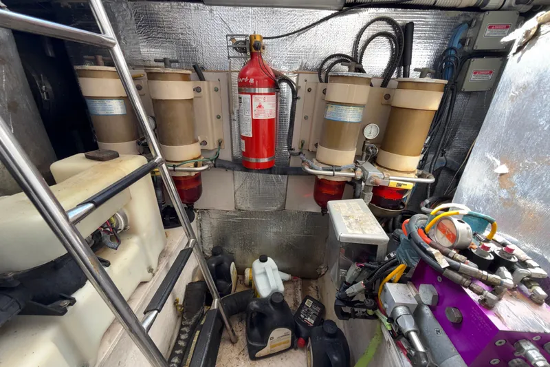 Gambit Yacht Photos Pics Engine room of 2001 Sea Ray 560 Sedan Bridge with fire extinguisher and equipment.