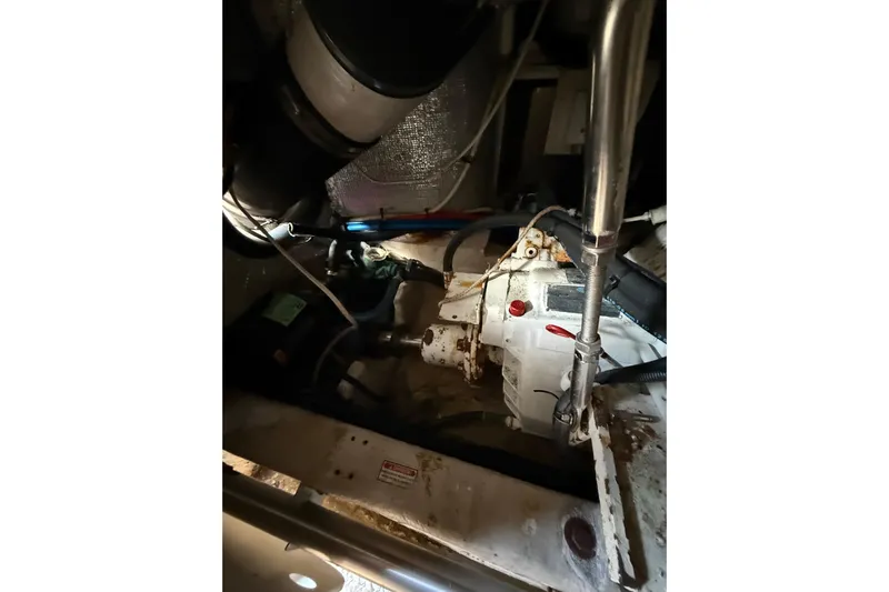 Gambit Yacht Photos Pics Engine room of a 2001 Sea Ray 560 Sedan Bridge, showing mechanical components and wiring.